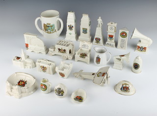 A collection of crested china including plane, gramophone and longcase clock 