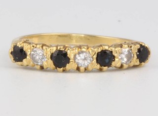 A yellow gold sapphire and diamond ring size L 