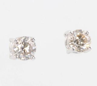 A pair of 18ct white gold single stone diamond ear studs 0.62ct