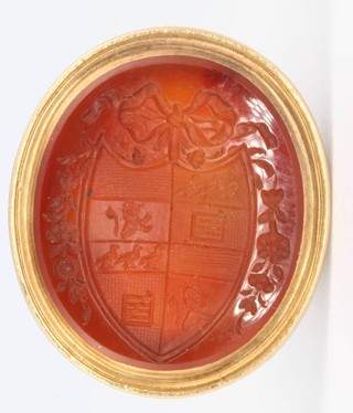 A yellow gold oval cornelian cut seal with armorial 