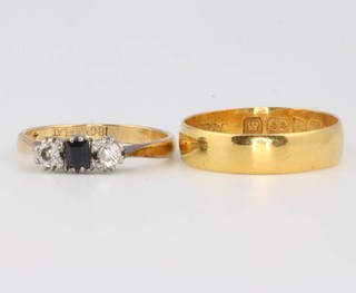A 22ct yellow gold wedding band size N 2.5 grams and an 18ct diamond and sapphire ring size K 