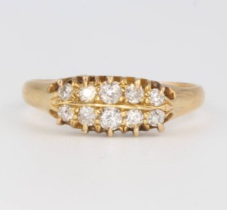 An 18ct yellow gold diamond set ring size N 1/2
