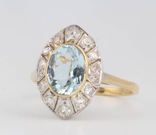An oval aquamarine and diamond cluster ring, the centre stone approx. 1.6ct surrounded by brilliant cut diamonds approx. 0.4ct size N 1/2