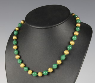A jade bead necklace interspersed with brushed 14k yellow gold beads 45cm 