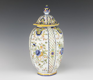 A Quimper octagonal baluster vase and cover decorated with flowers 33cm 