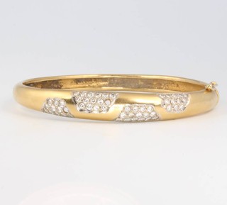 An 18ct yellow gold bangle set with brilliant cut diamonds 24 grams