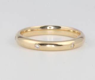 A 9ct yellow gold wedding band set with 6 brilliant cut diamonds 3.3 grams, size Q