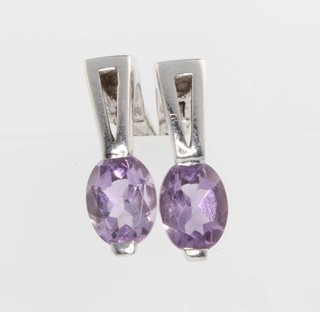 A pair of 14ct white gold amethyst ear clips 