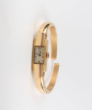 A lady's stylish 18ct yellow gold rectangular wristwatch by Paul Buhre on a do. expanding bracelet, gross weight 16.4 grams 
