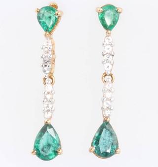 A pair of 9ct yellow gold pear cut emerald and diamond earrings, the emeralds approx. 1.4ct the diamonds approx 0.27ct