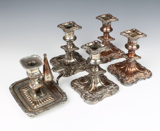 Four silver plated candlesticks and a plated chamberstick 