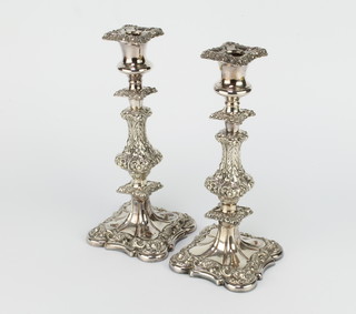 A pair of Sheffield plate candlesticks with baluster stems 29cm 