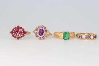 Four 9ct yellow gold gem set rings size P