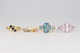 Four 9ct yellow gold gem set rings size Q 