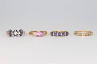 Four 9ct yellow gold gem set rings size Q 