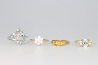 Four 9ct yellow gold gem set rings size Q 