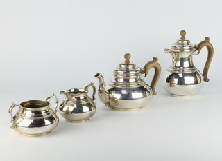 A 4 piece silver tea and coffee set with fruitwood handles London 1939/40, gross weight 1503 grams 