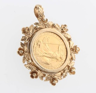 A 1/10th oz Britannia coin 1987 in a 9ct yellow gold mount, gross 5.9 grams 