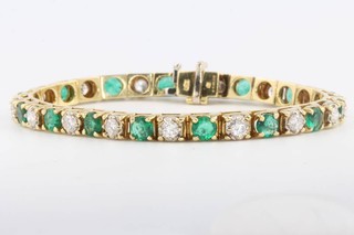 An 18ct yellow gold brilliant cut emerald and brilliant cut diamond bracelet, diamonds approx. 2.5ct, the emeralds approx. 4ct 17.5cm 