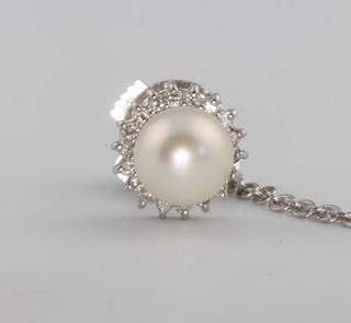 A white gold cultured pearl and diamond steel set tie pin 