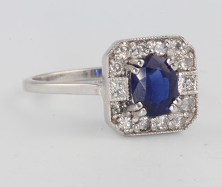 An 18ct white gold Art Deco style sapphire and diamond cluster ring size N 