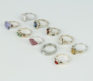 A silver gem set dress ring size N and 9 others