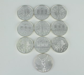 Ten silver commemorative crowns, 10 ozs 