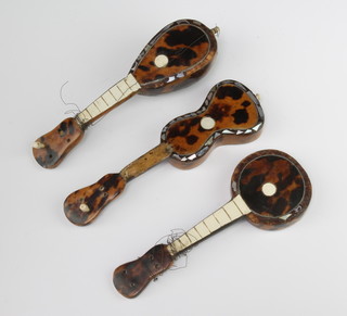 A miniature tortoiseshell and mother of pearl banjo 13cm, a do. guitar and mandolin 