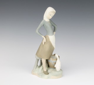 A Lladro matt figure of a goose girl 22cm 