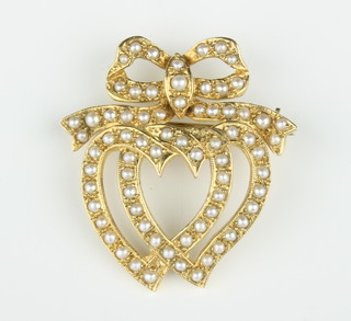 A 9ct yellow gold seed pearl double heart and ribbon brooch