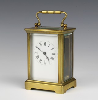 A 19th Century French 8 day carriage timepiece with enamelled dial and Roman numerals contained in a gilt metal case 11cm h x 7.5cm w x 5.5cm d 