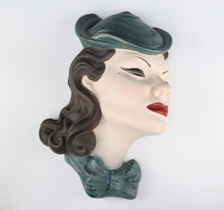 An Art Deco style plaster wall mask in the form of a lady wearing a hat 32cm 