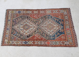 A Caucasian style blue and white ground rug with 2 central medallions in multirow borders 228cm x 140cm 