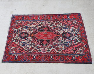 A red and blue ground Persian carpet with central medallion 229cm x 163cm 
