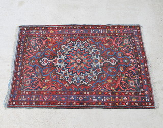 A blue and red ground Persian rug with central medallion 209cm x 140cm 