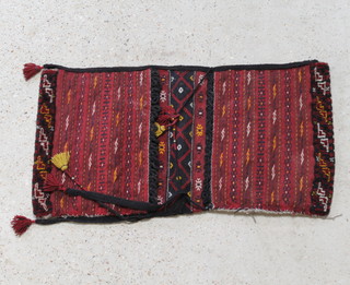 An Afghan red and black saddle bag 110cm x 60cm 