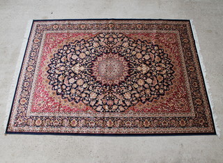 A blue ground Keshan Belgian cotton style carpet with central medallion, 280cm x 200cm 
