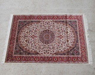 A beige ground Kashan style rug with central medallion 190cm x 140cm 