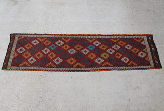 An orange and tan ground Suzani Kilim rug with all-over diamond design 275cm x 74cm 
