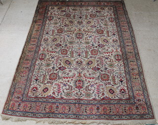 A white ground Persian Tabriz carpet with floral decoration 392 x 291cm 