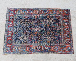 A blue and brown ground Persian Tabriz rug 172cm x 125cm