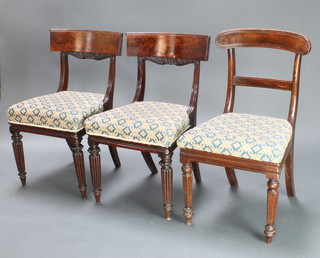 A pair of William IV mahogany bar back dining chairs with upholstered drop in seats, raised on turned and reeded supports and 1 other pair with shaped mid rails