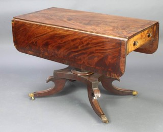 A Georgian mahogany pedestal Pembroke table with crossbanded top, fitted a frieze drawer and raised on a chamfered column with triform base, scroll feet ending in paw caps and castors 70cm h x 107cm w x 53cm when closed x 108cm when open 