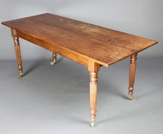 A William IV rectangular mahogany dining table raised on turned and fluted supports 74cm h x 180cm l x 73cm w 