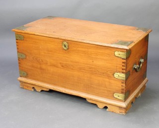 A 19th/20th Century Anglo Indian hardwood and brass mounted trunk, the interior fitted 2 candle boxes with brass banding and iron drop handles, raised on bracket feet 59cm h x 112cm w x 57cm d 
