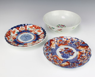 An early 20th Century Chinese famille rose bowl decorated with flowers and fruit 22cm, 2 Imari scalloped plates 22cm 
