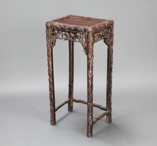 A rectangular carved and pierced Chinese hardwood occasional table with carved pierced apron 72cm h x 34cm w x 25cm d 