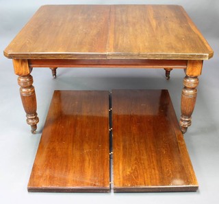 A Victorian mahogany extending dining table raised on turned and reeded supports 73cm h x 122cm w x 135cm l when closed x 239cm l with the 2 leaves added 