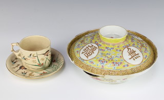 A 20th Century Chinese yellow ground shallow bowl and cover decorated with mon and floral motifs with 6 character mark 20cm and a Japanese ceramic teacup and saucer decorated with birds 