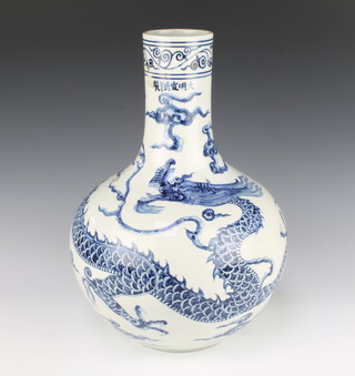 An 18th Century style Chinese blue and white oviform vase with narrow neck decorated a dragon chasing the flaming pearl 37cm 